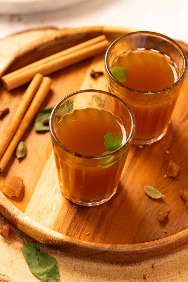 kadha garnished with fresh tulsi leaves