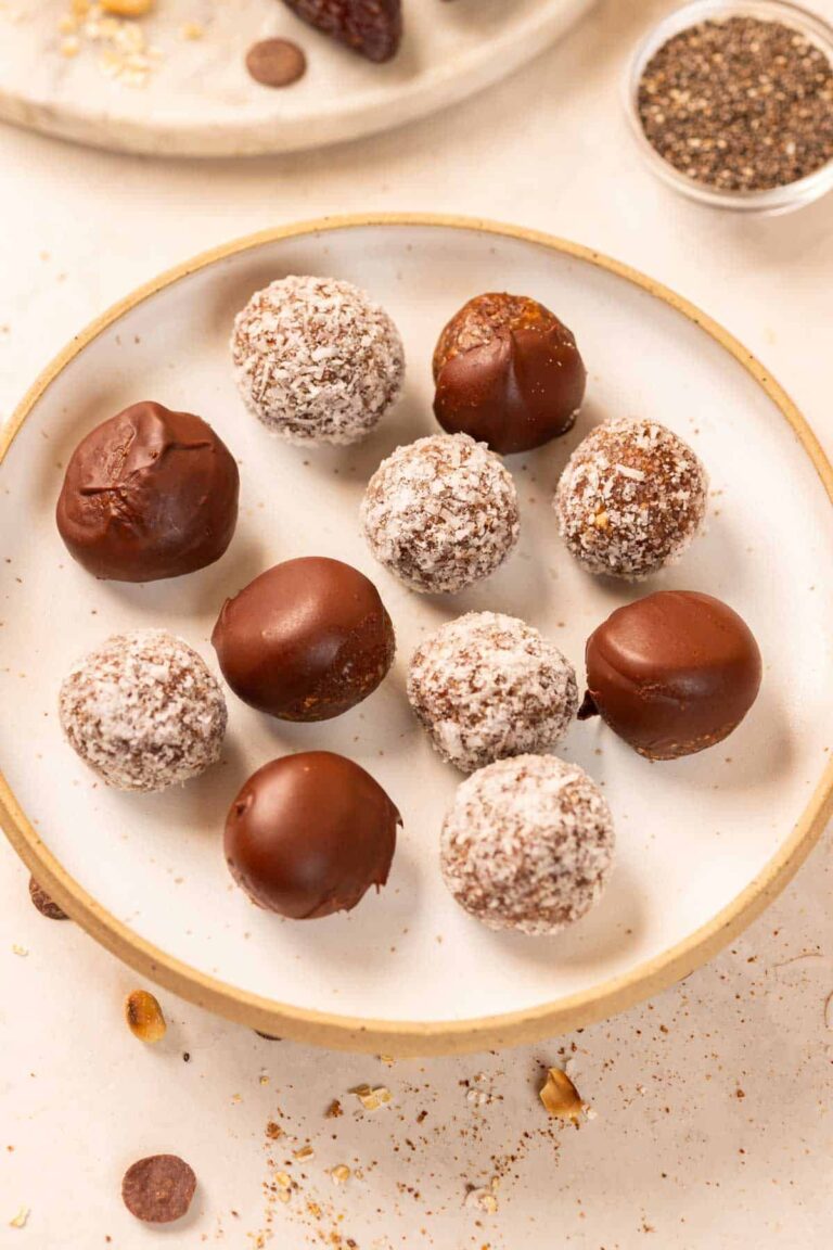 peanut butter oats energy balls with dates served on a white plate