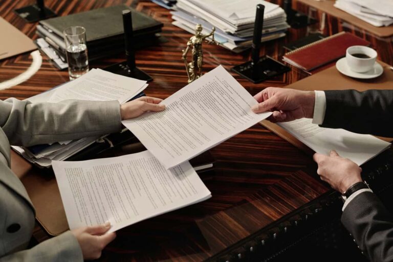 Lawyers exchanging documents