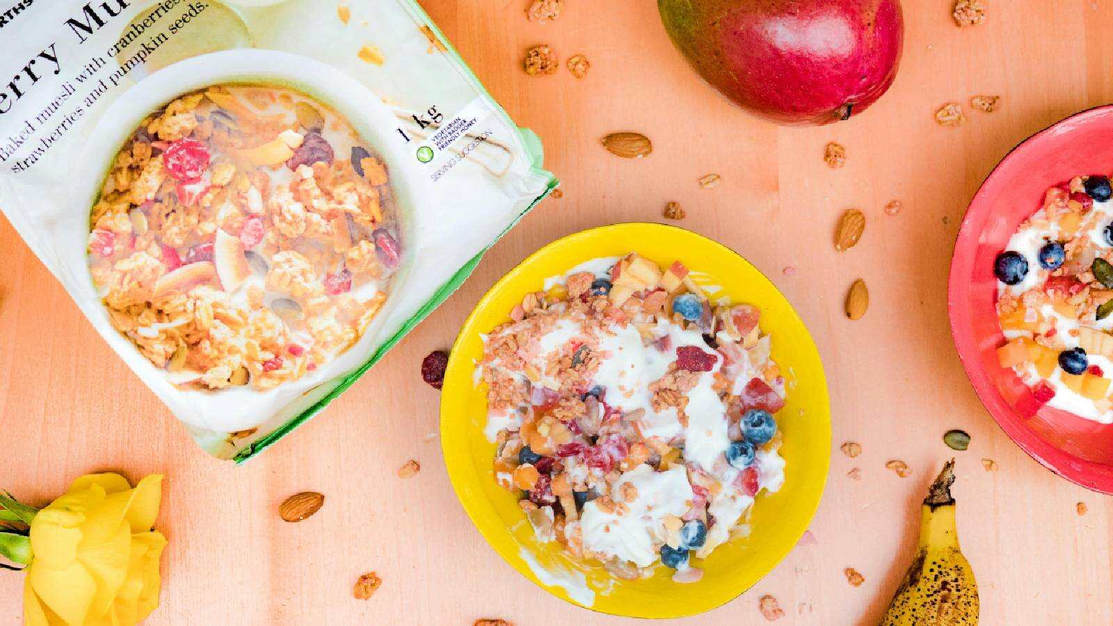 A bowl of muesli with a packet of store-brought muesli