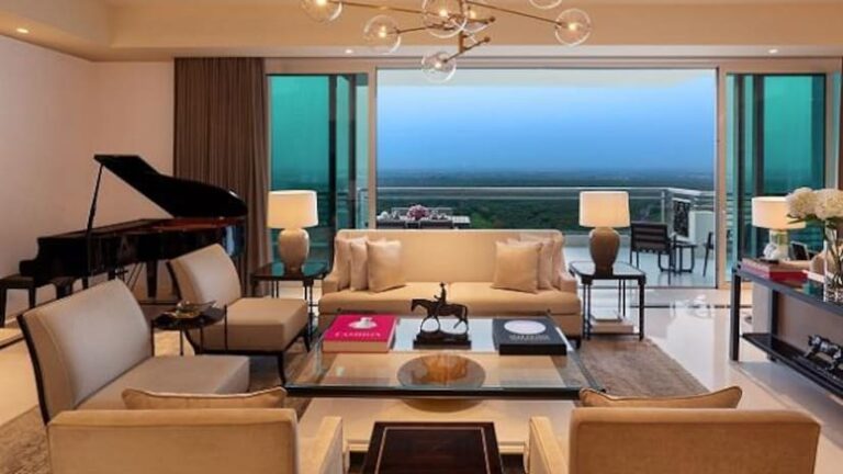 A living room with a view at DLF Camellias. The project has 429 units in 16 towers, with only one unit per floor and residences of 6,290-7,350 sq ft. It also has 14 penthouses.