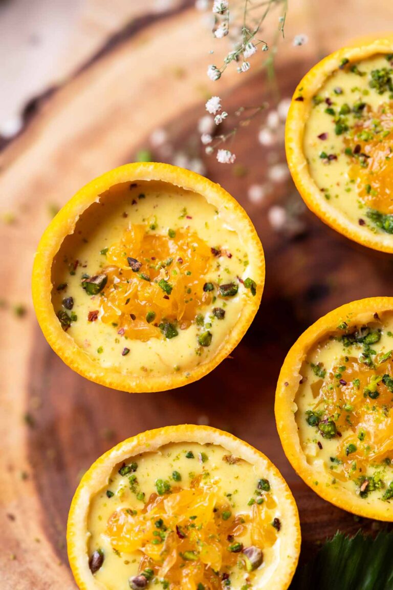 orange makhana pudding served in orange peel bowls