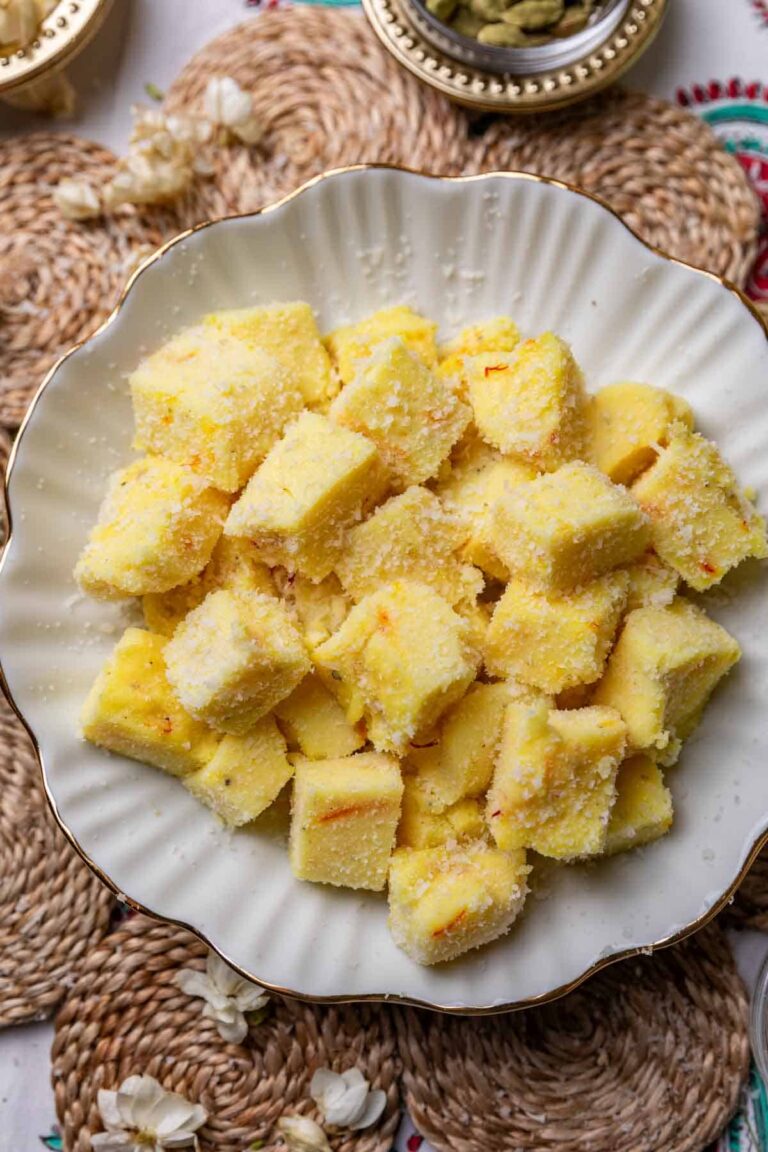 saffron milk pudding bites served in a white bowl