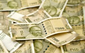 Rupee falls 2 paise to all-time low of 84.13 per dollar