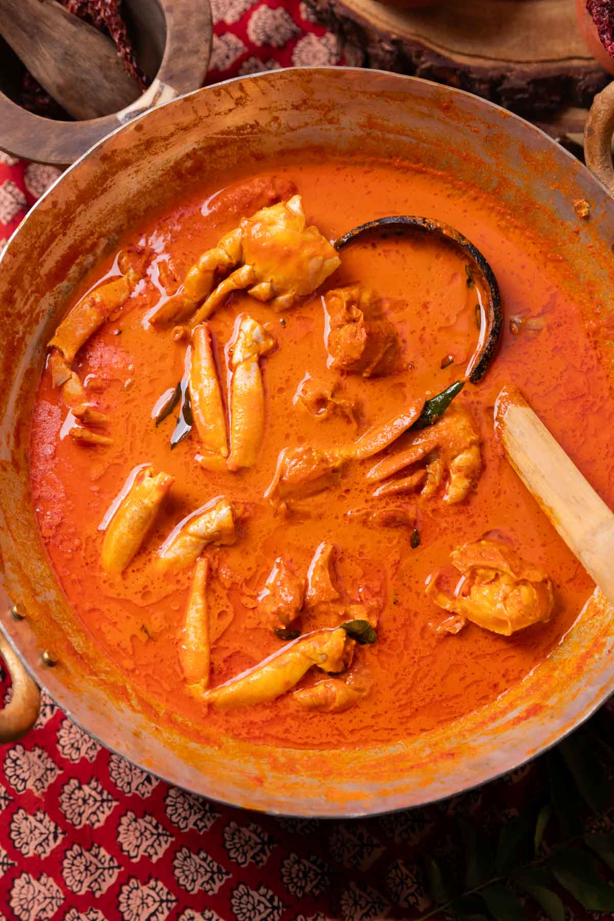 Mangalorean crab curry in a kadai with ladle