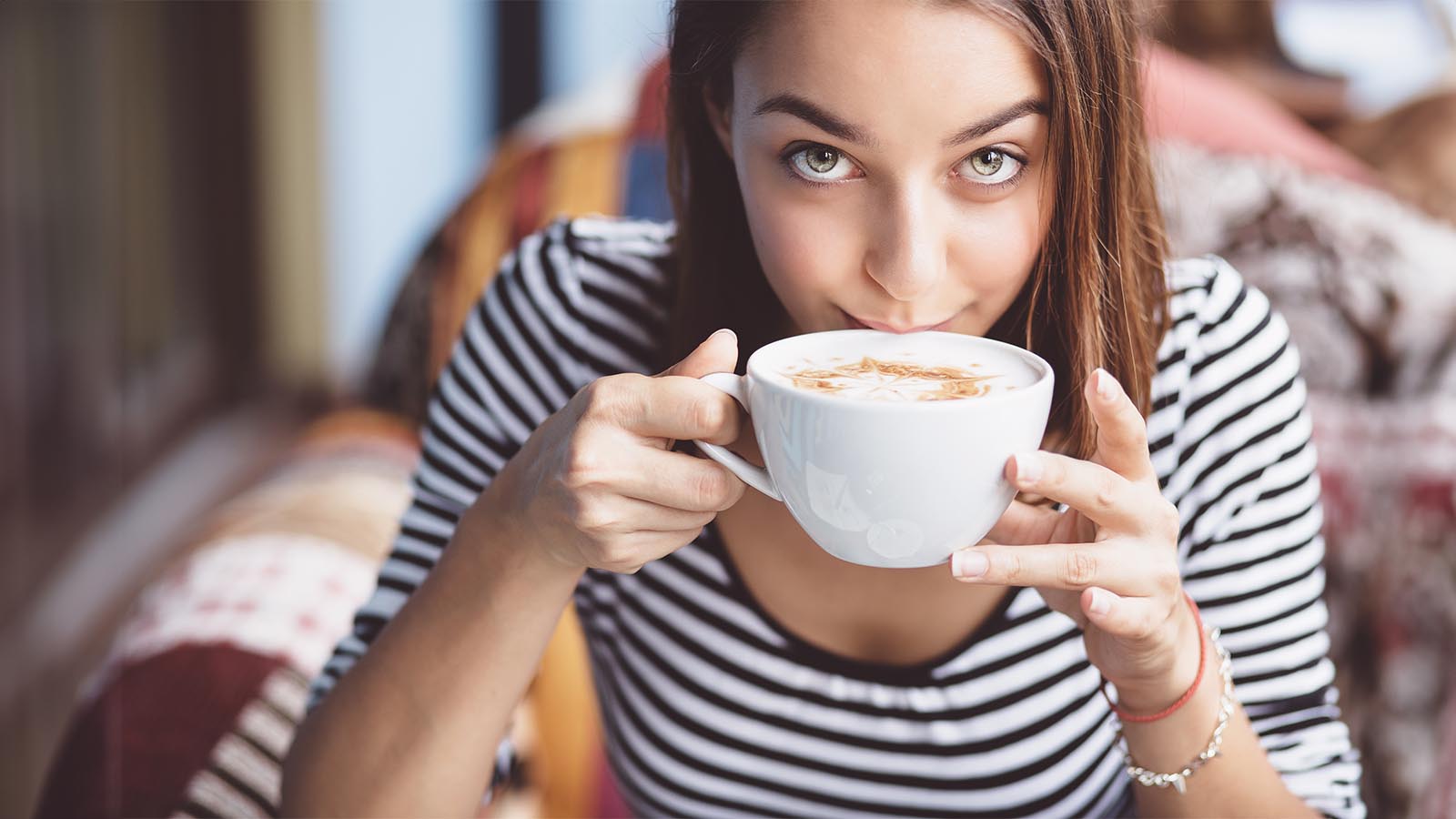 A woman drinking coffee